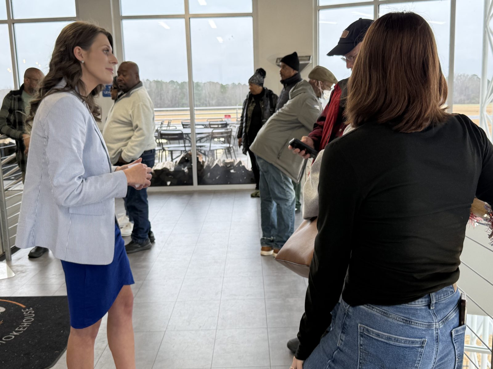Caitlin talking with Johnston County residents at a community gathering