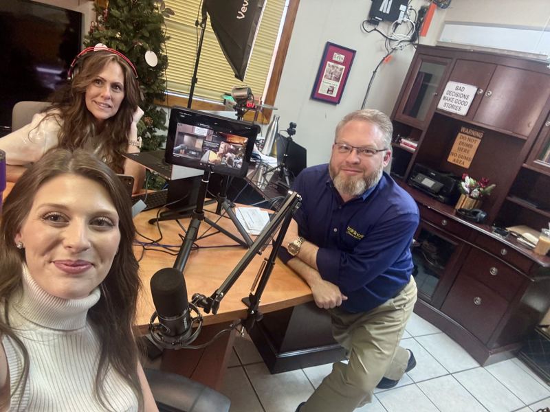 Caitlin at a podcast recording with two hosts